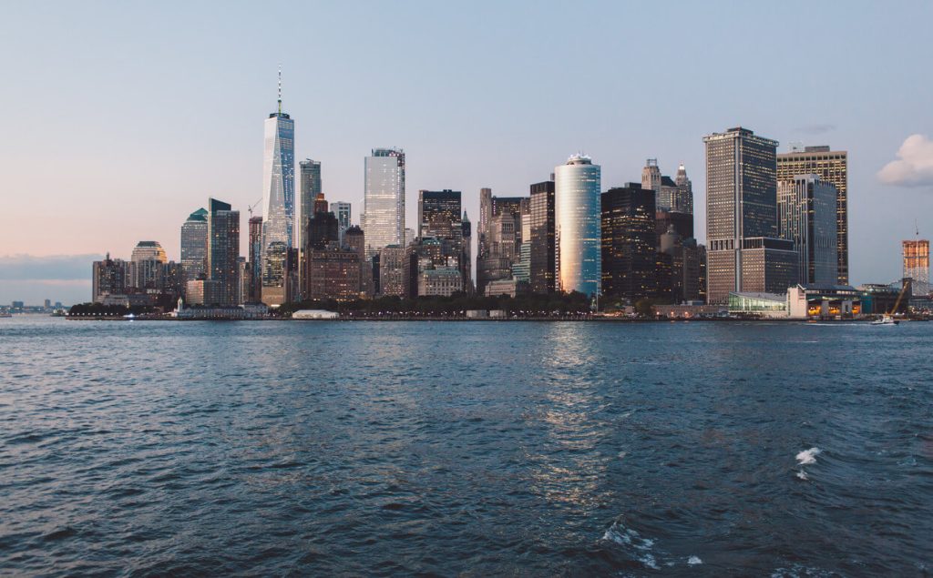 a view of buildings in new york city with the coastline