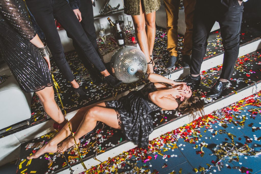 a woman is in the floor while partying in one of the nightclubs in dallas