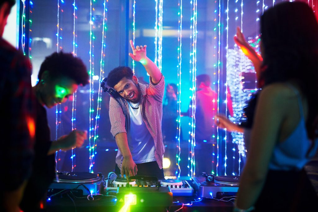 a dj playing a music in a nightclub in philadelphia